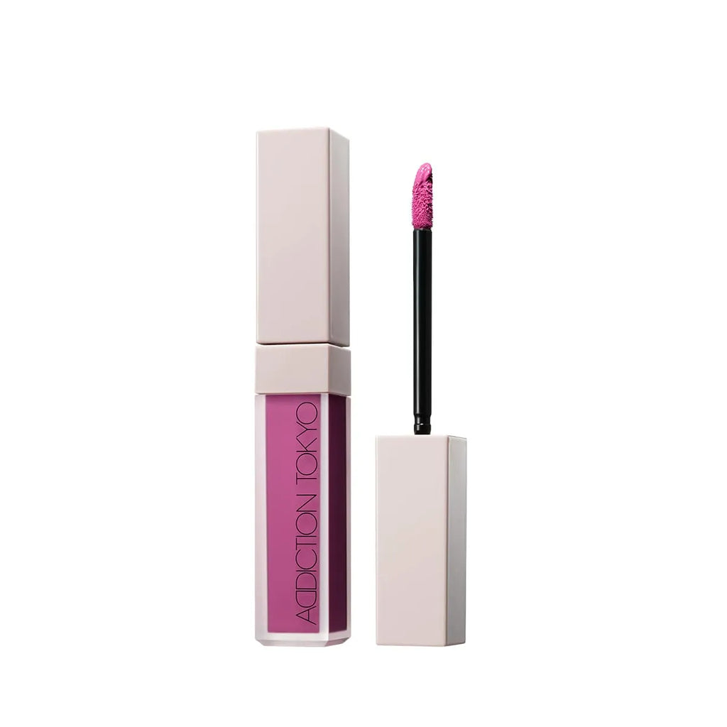 Addiction Tokyo The Liquid Blush Foggy in vibrant magenta shade offering a soft-focus finish and sleek applicator for a bold pop of color.