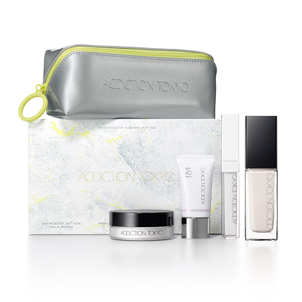 Addiction Glow Kit featuring foundation, primer, and face powder for flawless makeup application