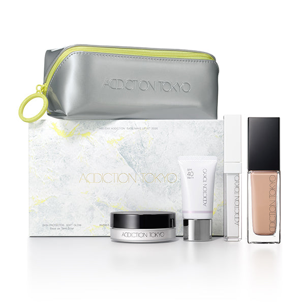 Addiction Glow Kit featuring foundation, primer, and face powder for flawless makeup application