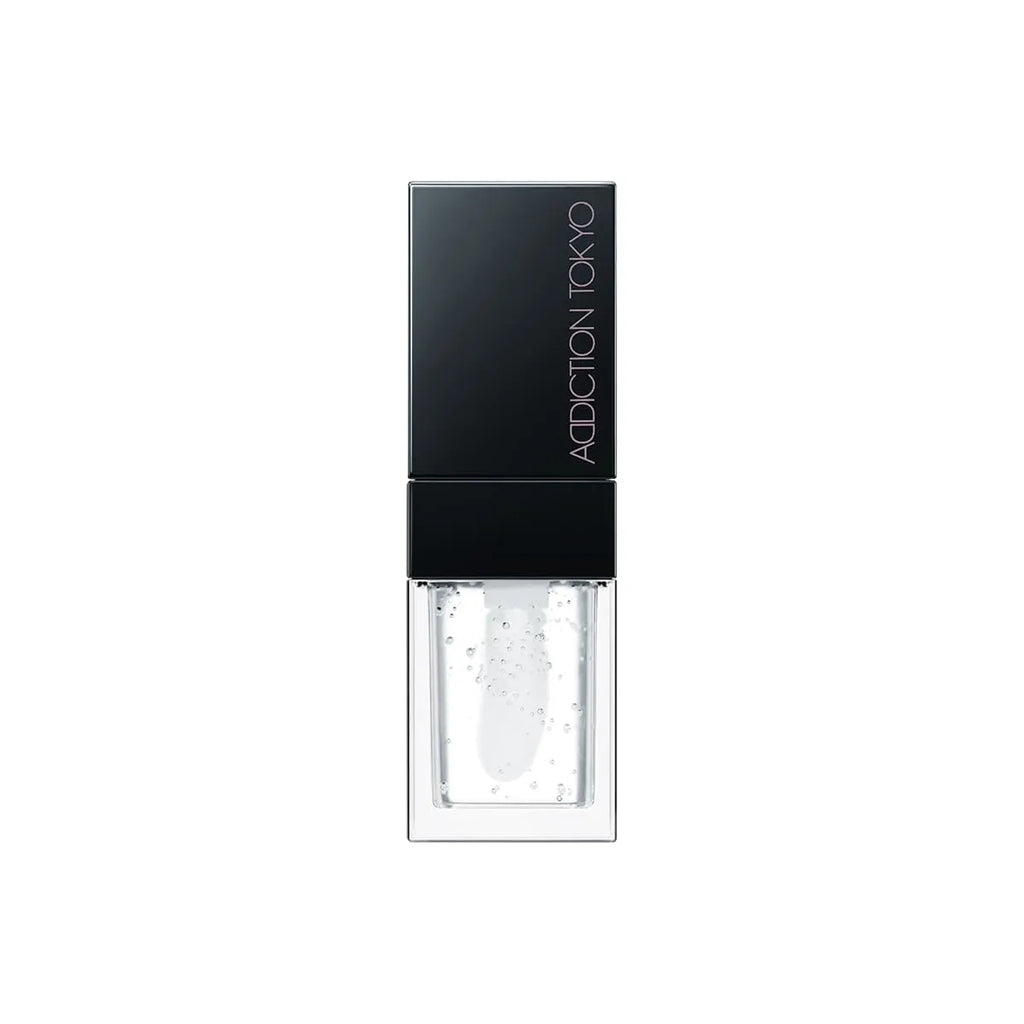 Addiction Tokyo Lip Oil Plumper 6.5ml in clear gloss with a black cap, featuring hydrating and plumping properties for lips.