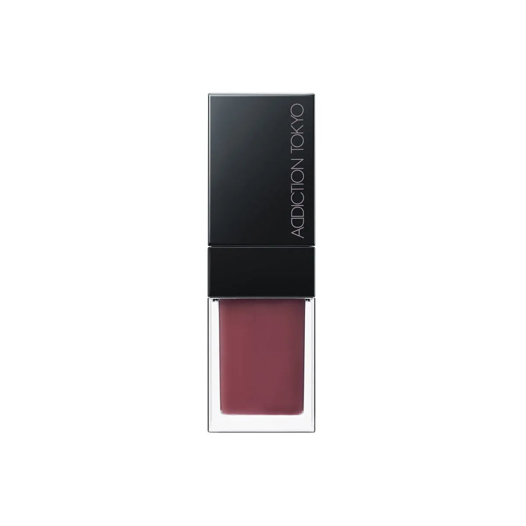 Addiction Tokyo Lip Oil Plumper 6.5ml in mauve shade with a black cap, providing a rich and moisturizing finish for lips.