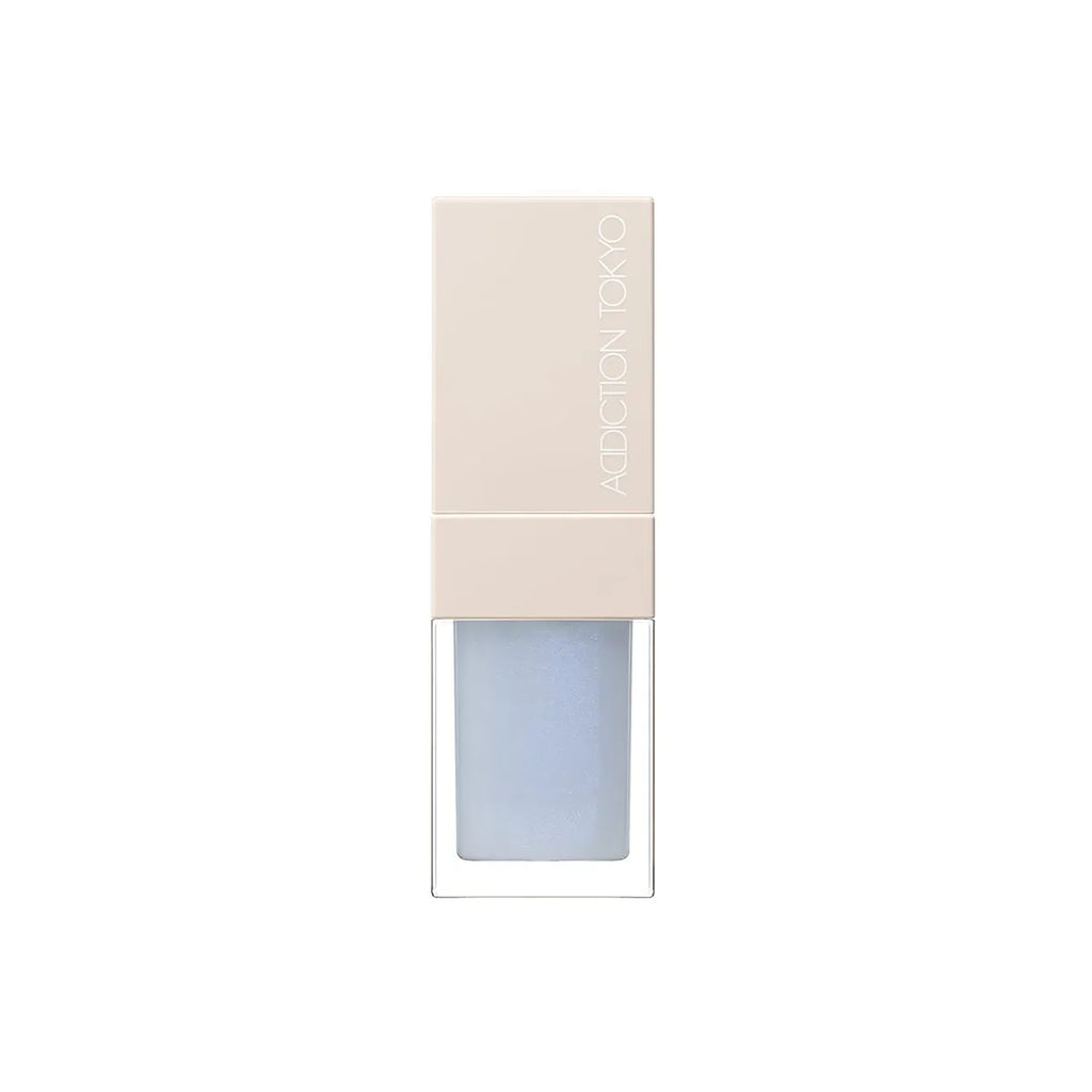 Addiction Tokyo Lip Oil Plumper 6.5ml in light blue shade with a beige cap, offering a glossy and hydrating finish for lips.