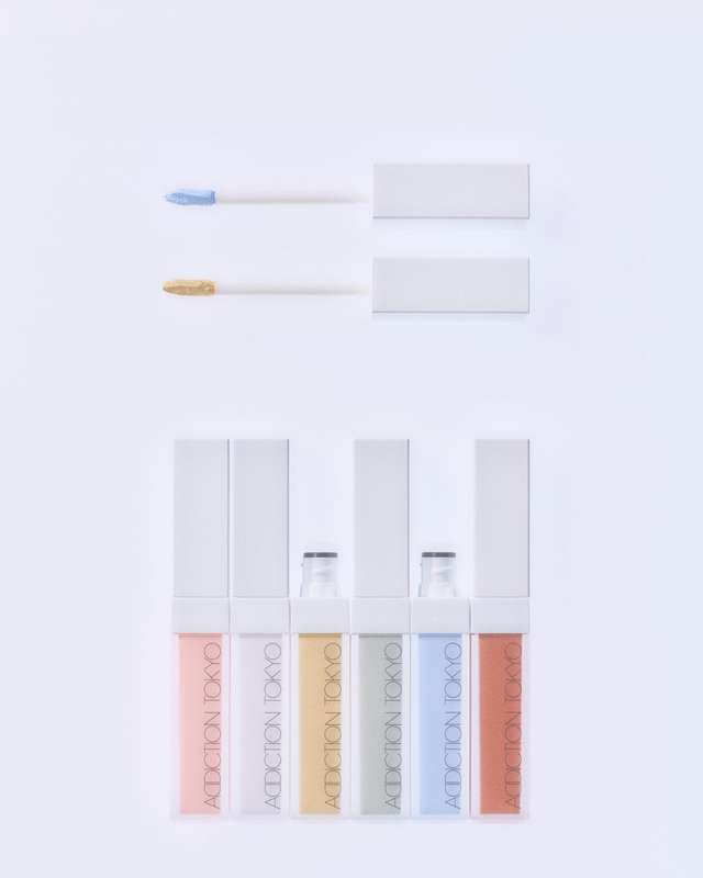 Addiction Tokyo Skin Reflect Color Corrector set with multiple shades for a flawless complexion. Features applicators in blue and yellow tones.