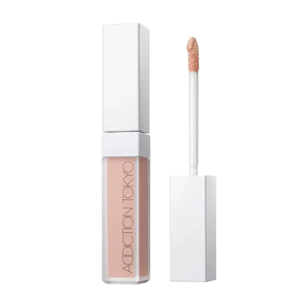 Tokyo Color Corrector in Bare Peach shade with a sleek white packaging and applicator. Provides a natural, long-lasting finish for even skin tone.