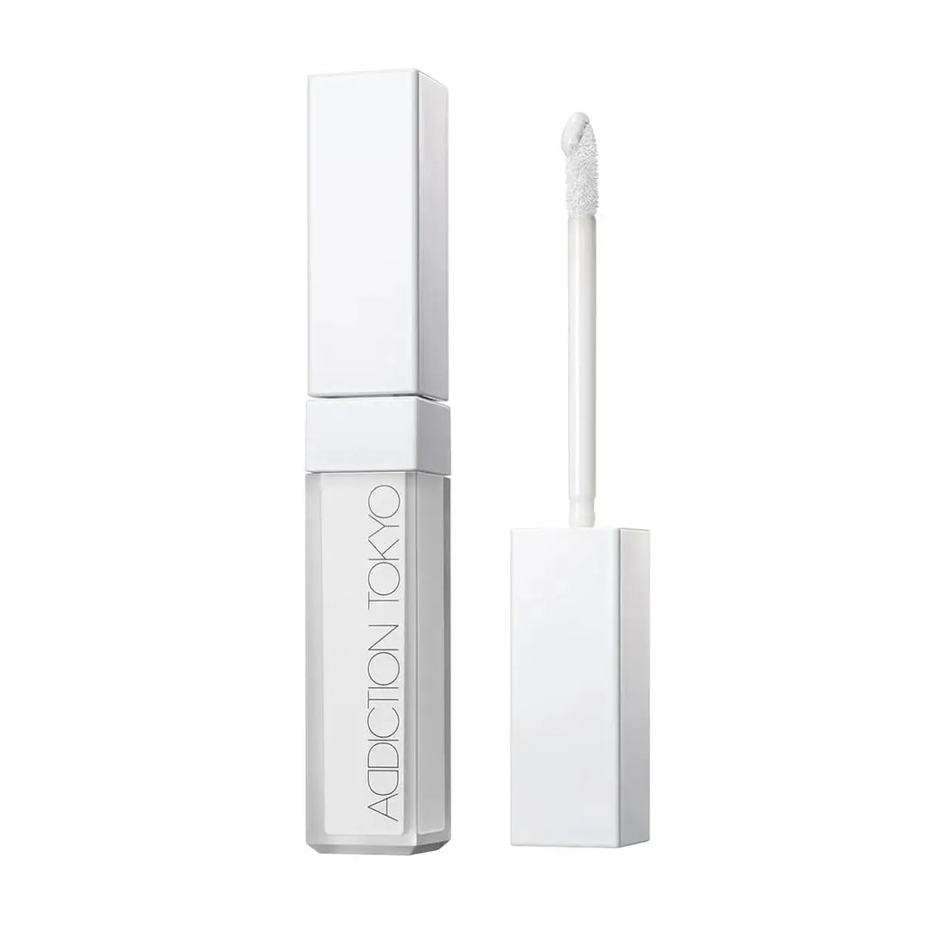 Tokyo Color Corrector in Solid White shade with a precision applicator. Enhances brightness and smooths skin for a flawless makeup base.