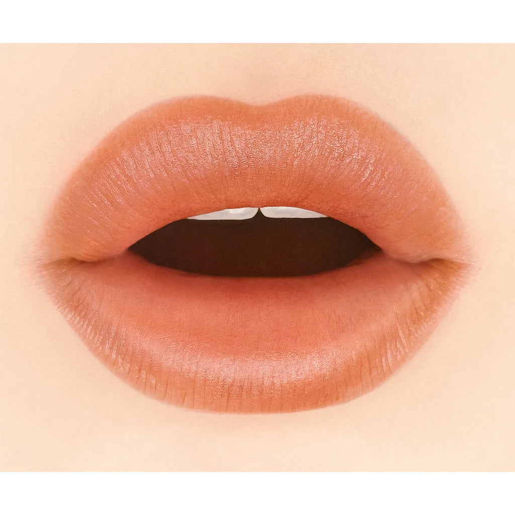 Close-up of lips wearing Addiction Tokyo The Lip Balm Soft Matte in a nude shade, showcasing a soft matte finish.