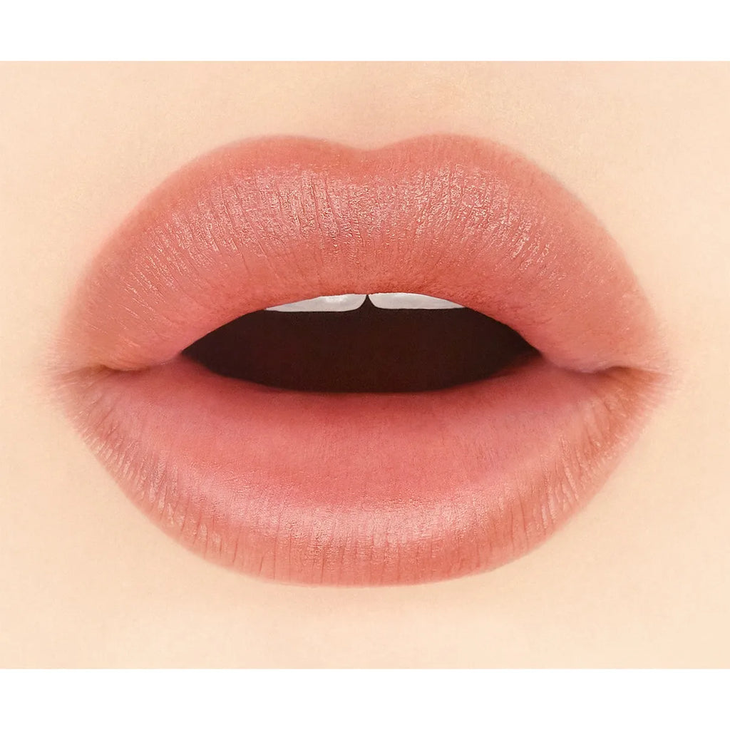 Close-up of lips wearing Addiction Tokyo The Lip Balm Soft Matte in a pink shade, highlighting a smooth matte texture.