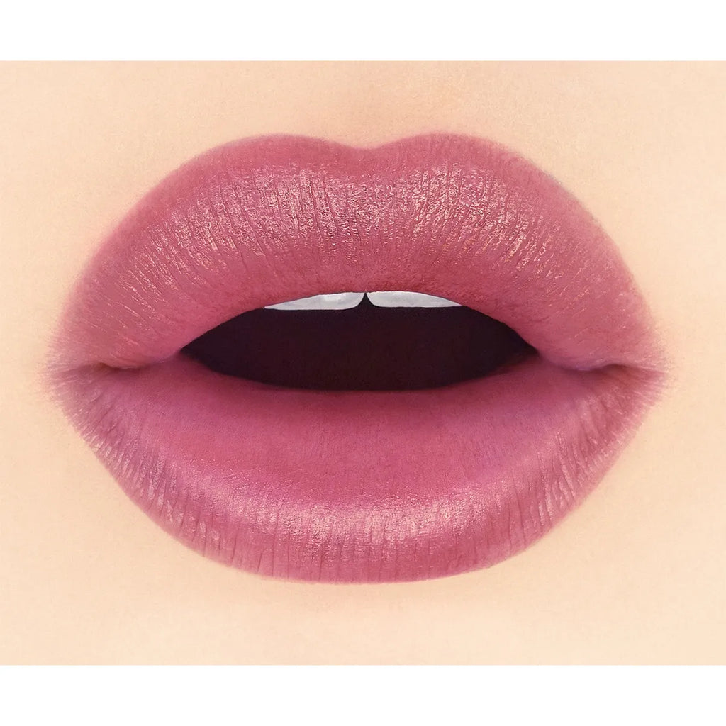 Close-up of lips wearing Addiction Tokyo The Lip Balm Soft Matte in a plum shade, emphasizing a velvety matte look.