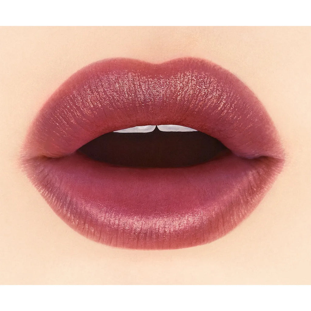 Close-up of lips wearing Addiction Tokyo The Lip Balm Soft Matte in a dark brown shade, highlighting a smooth matte texture.