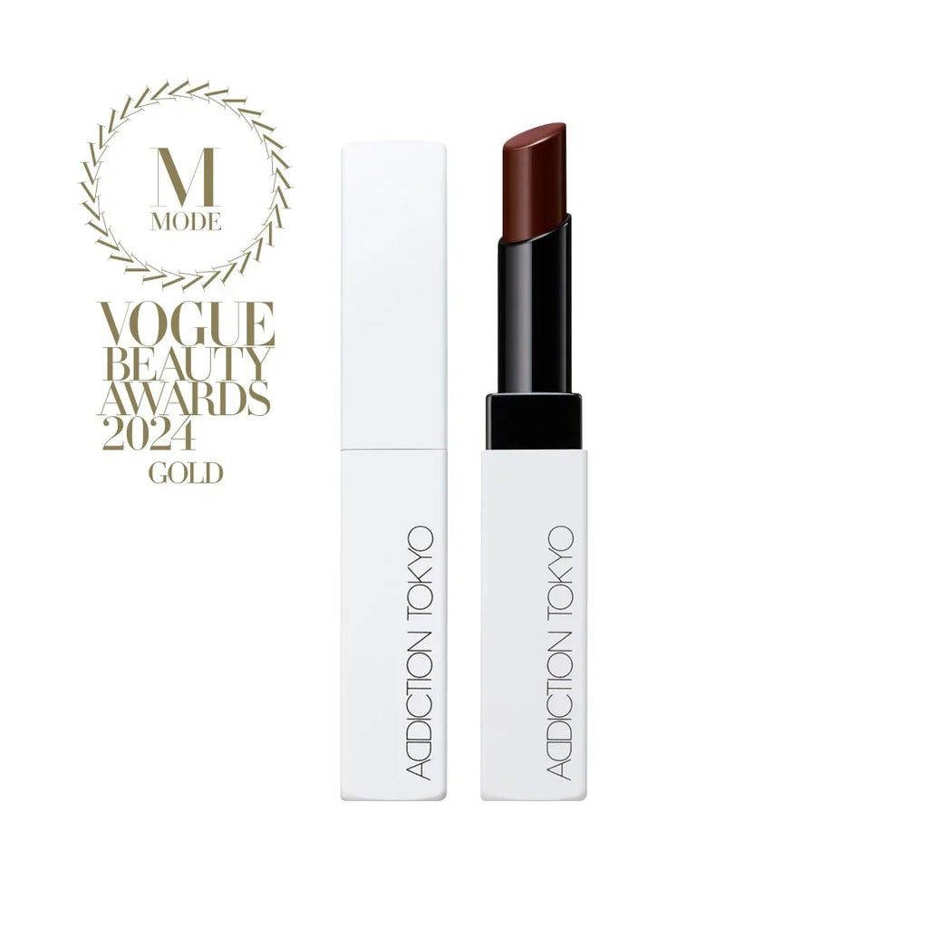 Addiction Tokyo The Lip Balm Soft Matte in dark brown shade with modern white packaging, Vogue Beauty Awards 2024 Gold winner.