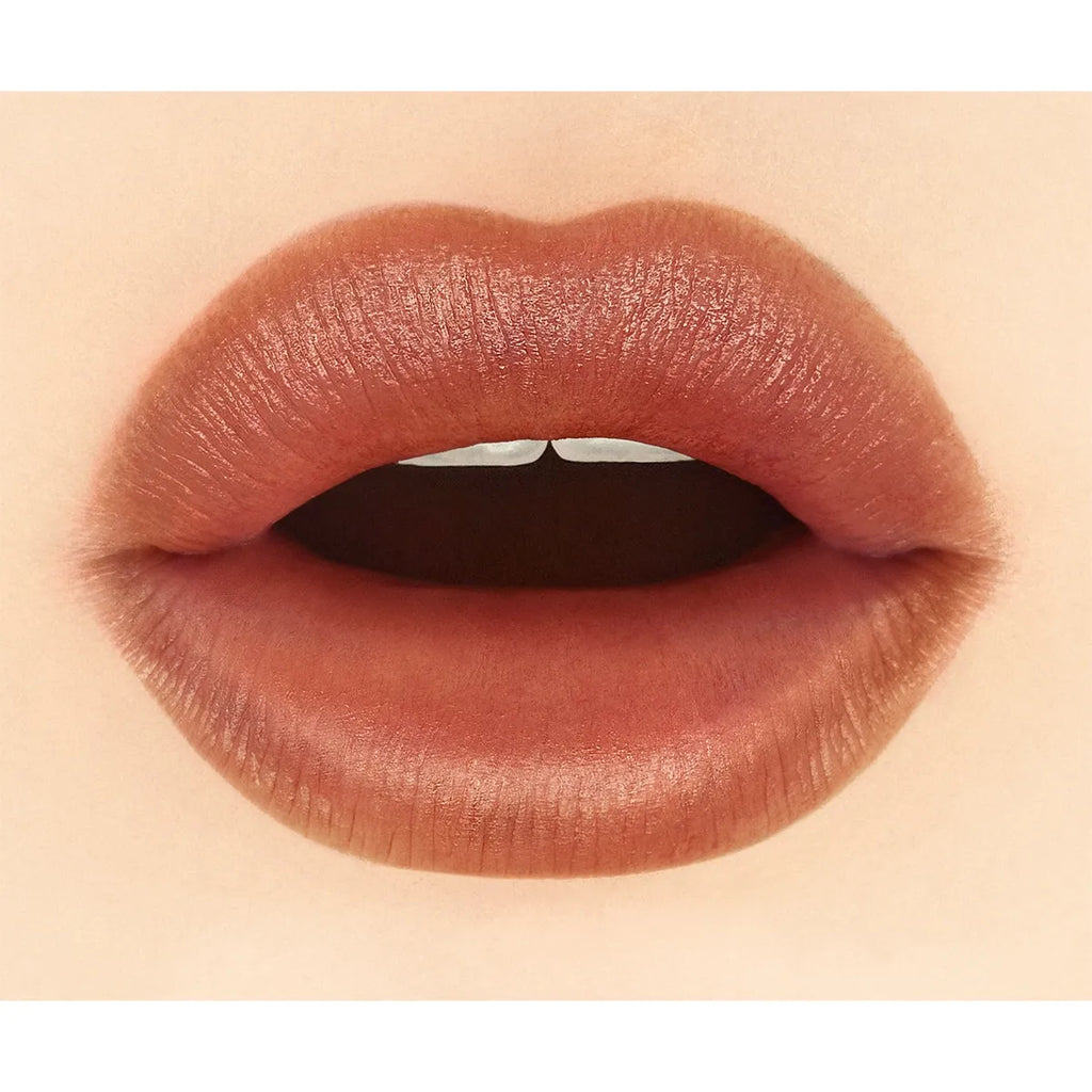 Close-up of lips wearing Addiction Tokyo The Lip Balm Soft Matte in a deep red shade, emphasizing a velvety matte look.