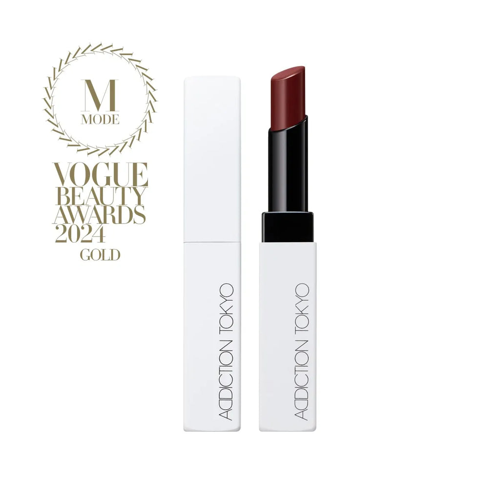 Addiction Tokyo The Lip Balm Soft Matte in deep red shade with minimalist white packaging, recognized with Vogue Beauty Awards 2024 Gold.