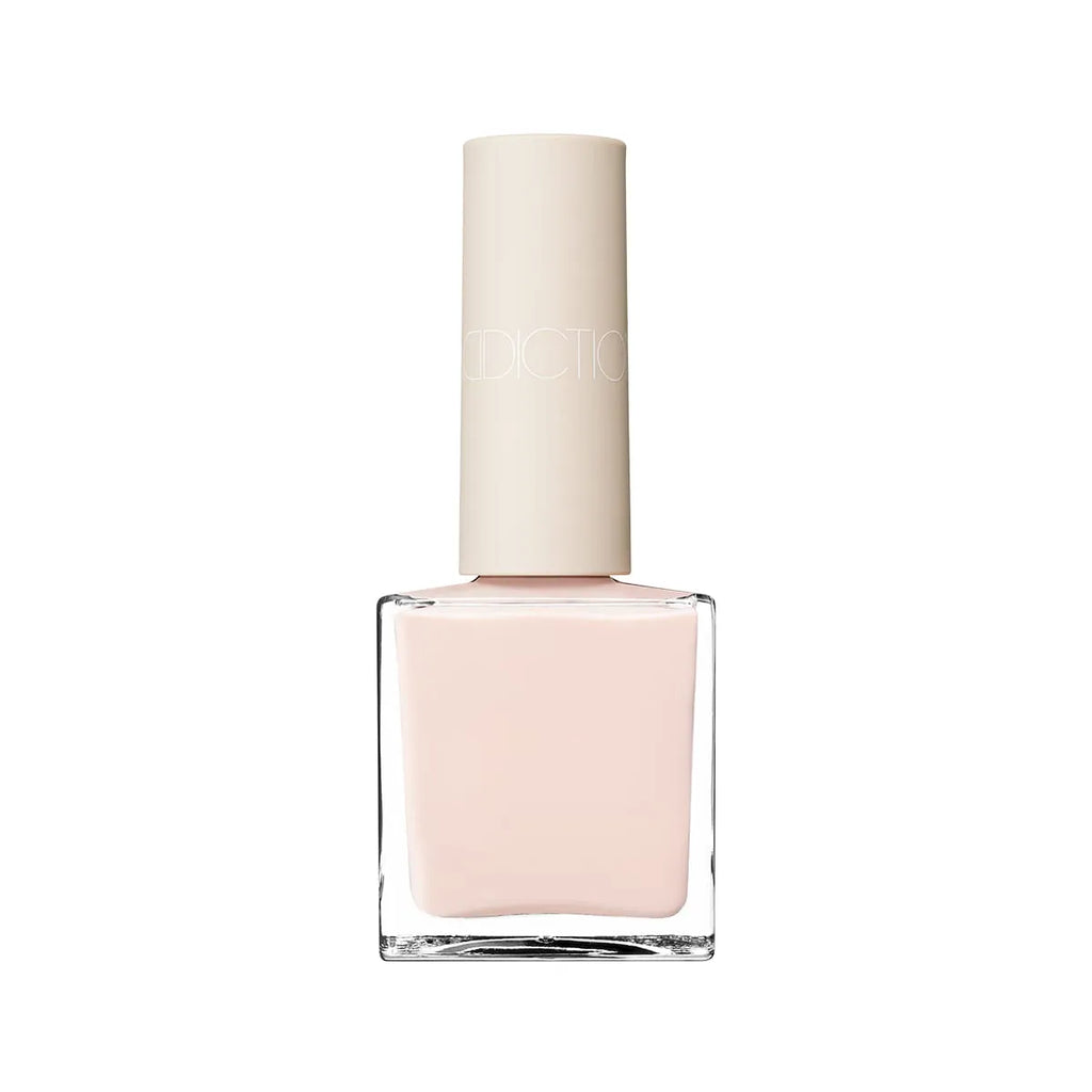 Addiction Tokyo Nail Polish in Silenced Serenity, a soft beige shade with a glossy finish. Quick-drying, long-lasting, and 9-free formula.