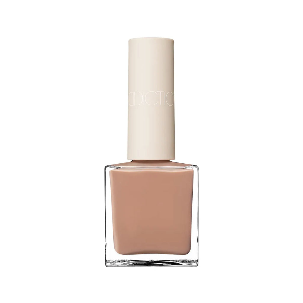 Addiction Tokyo Nail Polish in a warm taupe shade with a glossy finish. Long-lasting, quick-drying, and 9-free for nail care.