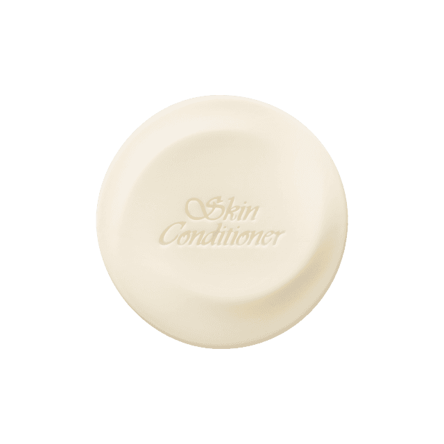 Albion Skin Conditioner Cleansing Bar 100g, embossed with 'Skin Conditioner,' designed for effective facial cleansing and smooth skin.