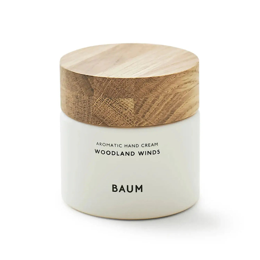 Baum Aromatic Hand Cream Woodland Winds 150ml jar with wooden cap, offering moisture and natural fragrance.