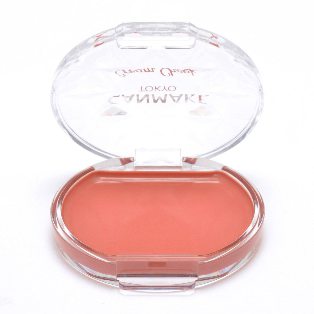 Open Canmake Cream Check 2.2g compact in coral shade, emphasizing its smooth and blendable formula for a radiant look.