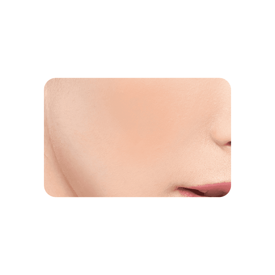 Close-up of a model's cheek showcasing the natural finish of Cezanne Cheek Blush 2.2g, blending seamlessly for a soft complexion.