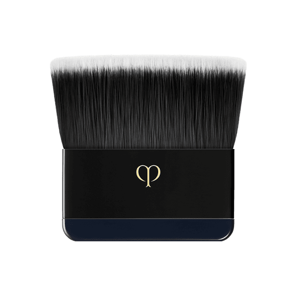 Clé de Peau Beauté foundation compact case in navy with a gold logo, offering a sleek and luxurious design for powder foundation storage.