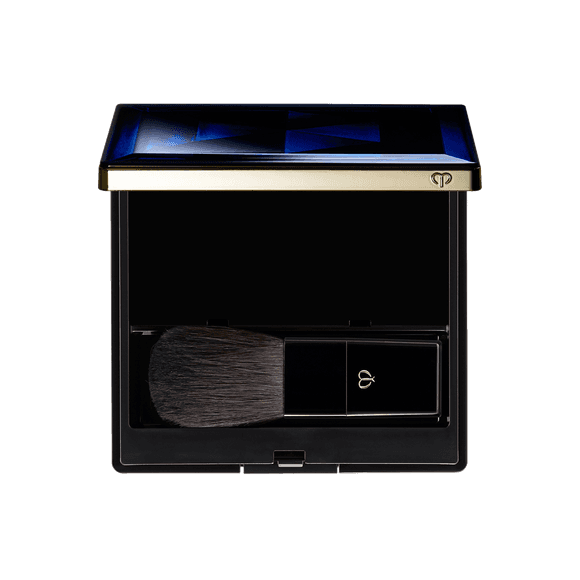 Clé de Peau Beauté Blush Duo Powder in a sleek black compact with a soft brush, designed for flawless application and portability.