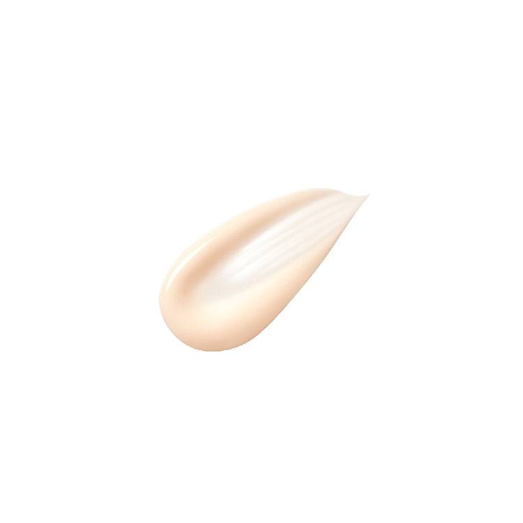 A smooth, creamy texture of Clé de Peau Beauté Firming Serum Supreme, highlighting its rich formula for moisturizing and firming the skin.