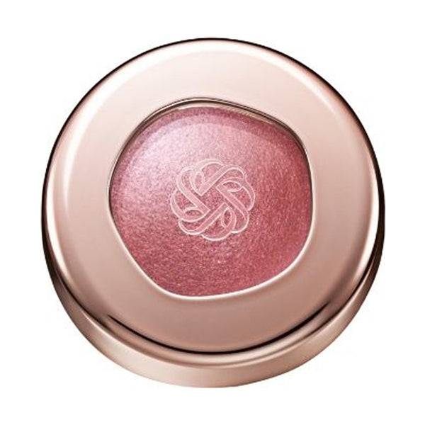 Cosme Decorté Eye Glow Gem Skin Shadow in a rosy pink shade with a luminous finish, encased in a rose gold compact.
