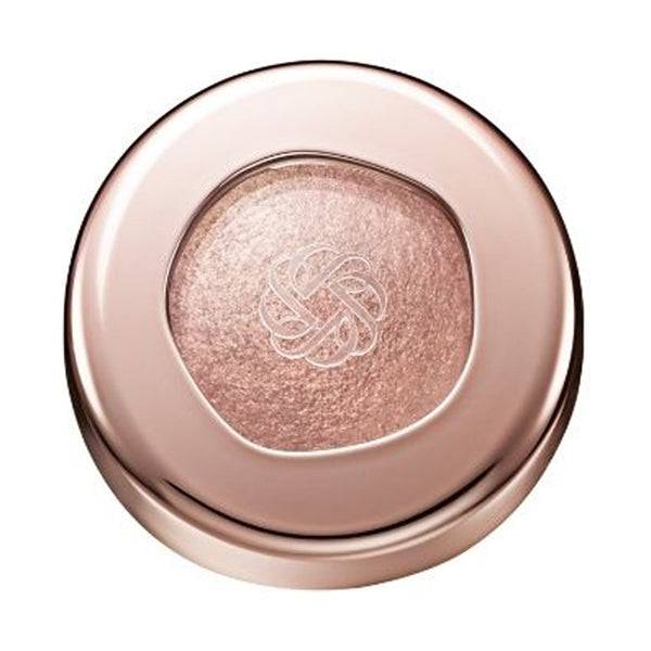 Cosme Decorté Eye Glow Gem Skin Shadow in a peachy pink shade with a radiant finish, presented in a rose gold compact.