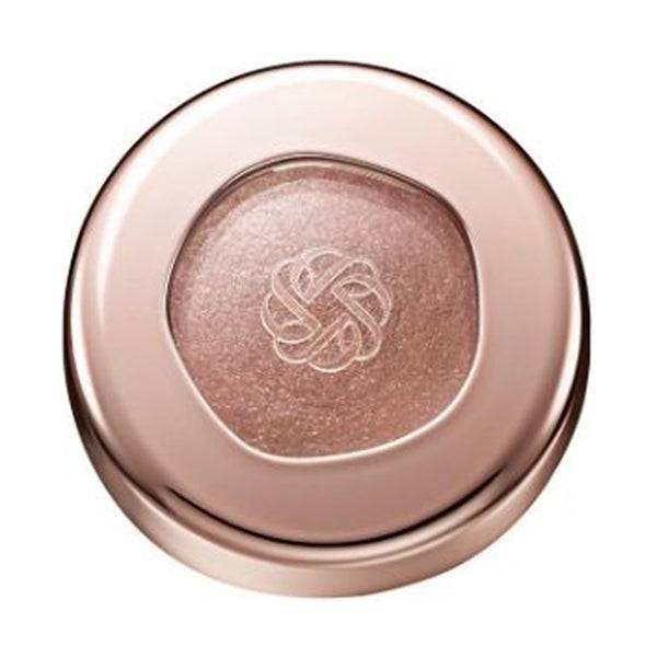 Cosme Decorté Eye Glow Gem Skin Shadow in a warm brown shade with a radiant finish, housed in a rose gold compact.