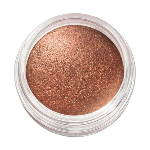 Close-up of Cosme Decorté Eye Glow Gem Skin Shadow in a bronze brown shade, emphasizing its metallic and smooth texture.