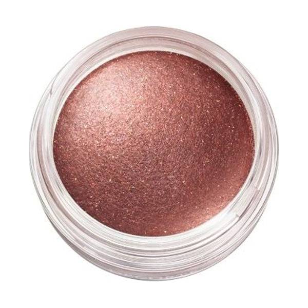 Close-up of Cosme Decorté Eye Glow Gem Skin Shadow in a deep plum shade, emphasizing its smooth and vibrant texture.