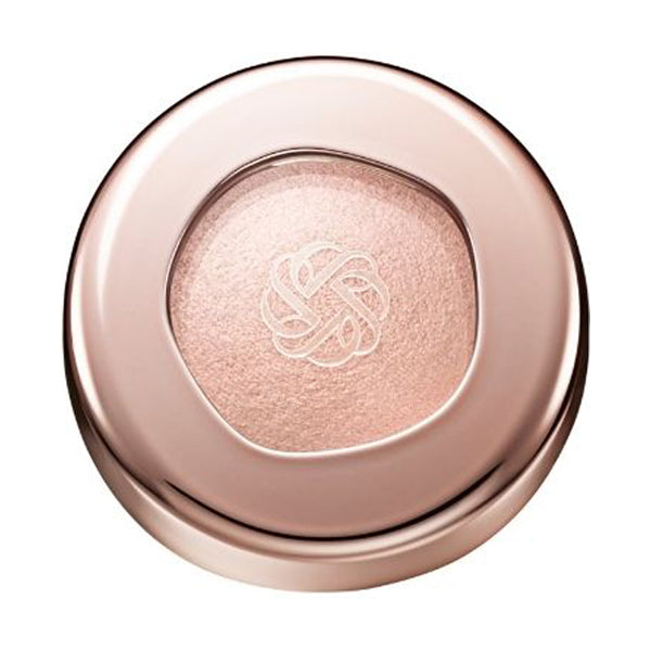 Cosme Decorté Eye Glow Gem Skin Shadow in a soft champagne shade with a luminous finish, encased in a sleek rose gold compact.