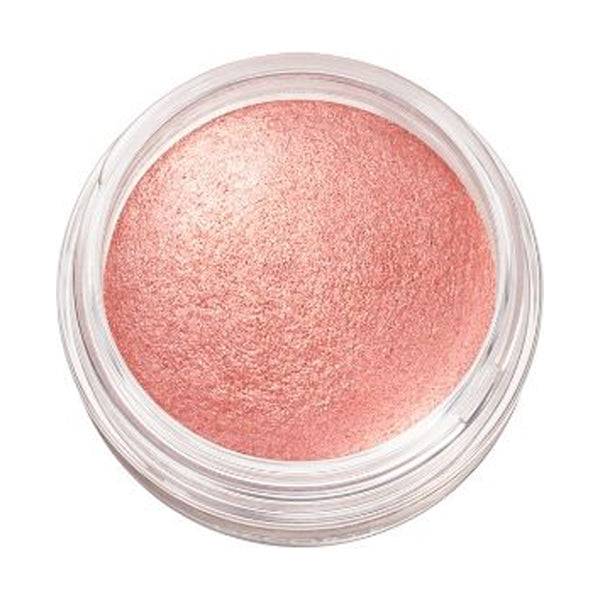 Close-up of Cosme Decorté Eye Glow Gem Skin Shadow in a coral pink shade, highlighting its smooth and vibrant texture.