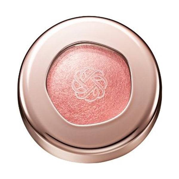 Cosme Decorté Eye Glow Gem Skin Shadow in a coral pink shade with a radiant finish, housed in a rose gold compact.