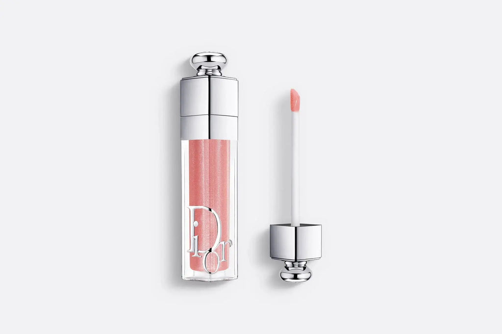 Dior Addict Lip Maximizer in Peachmania, a limited-edition lip gloss with a soft peach hue for a radiant, plumping, and hydrating effect.