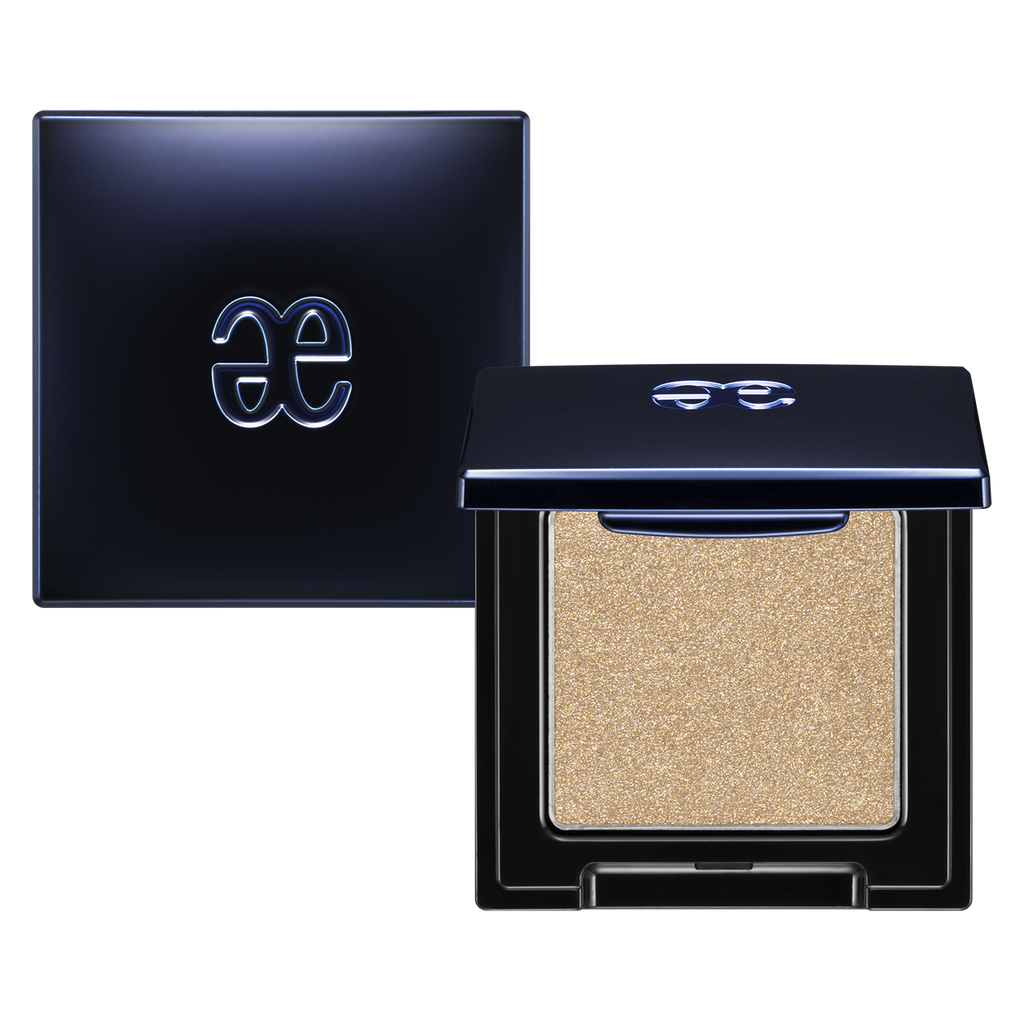 Elégance Razzle Eye Color in shimmering gold shade, featuring a sleek black compact with a bold logo. Perfect for vibrant, long-lasting eye makeup.