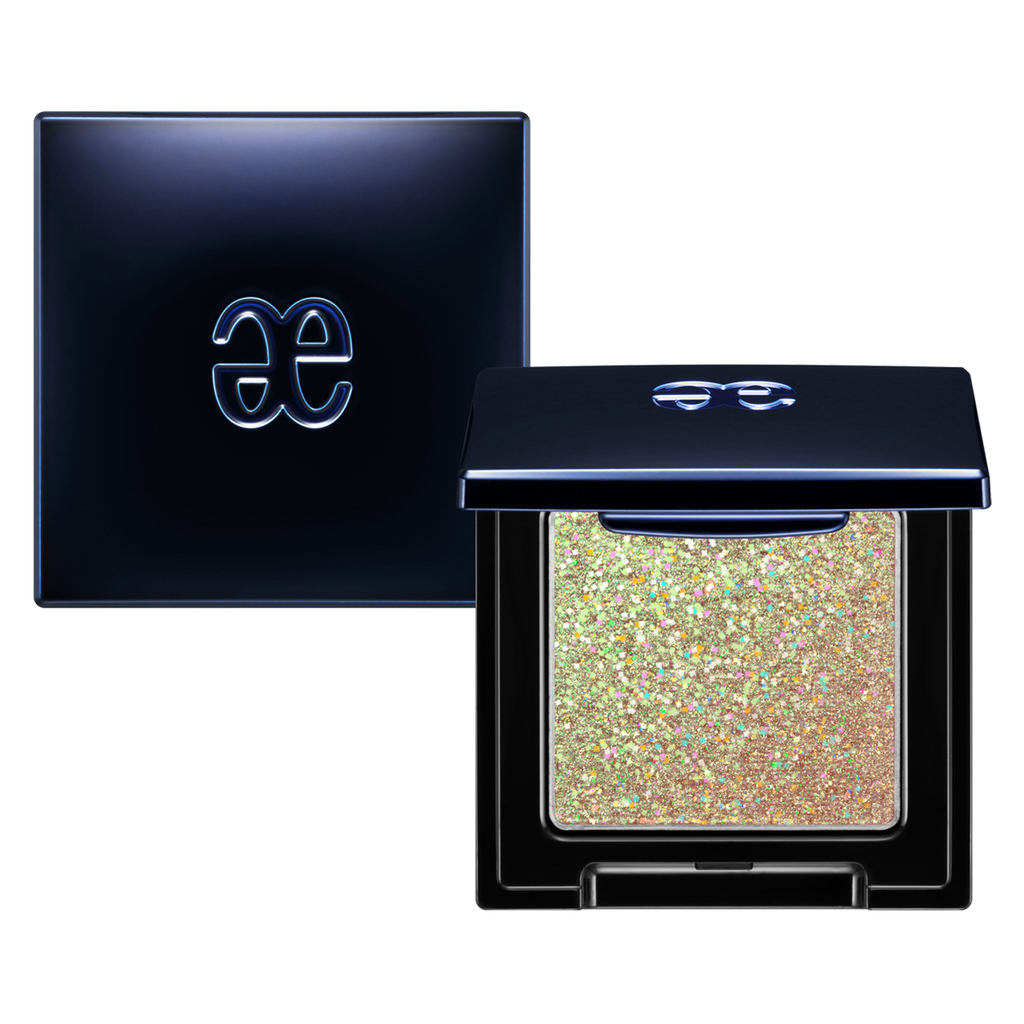 Elégance Razzle Eye Color in holographic gold shade, presented in a sleek black compact. Designed for dazzling and unique eye makeup.