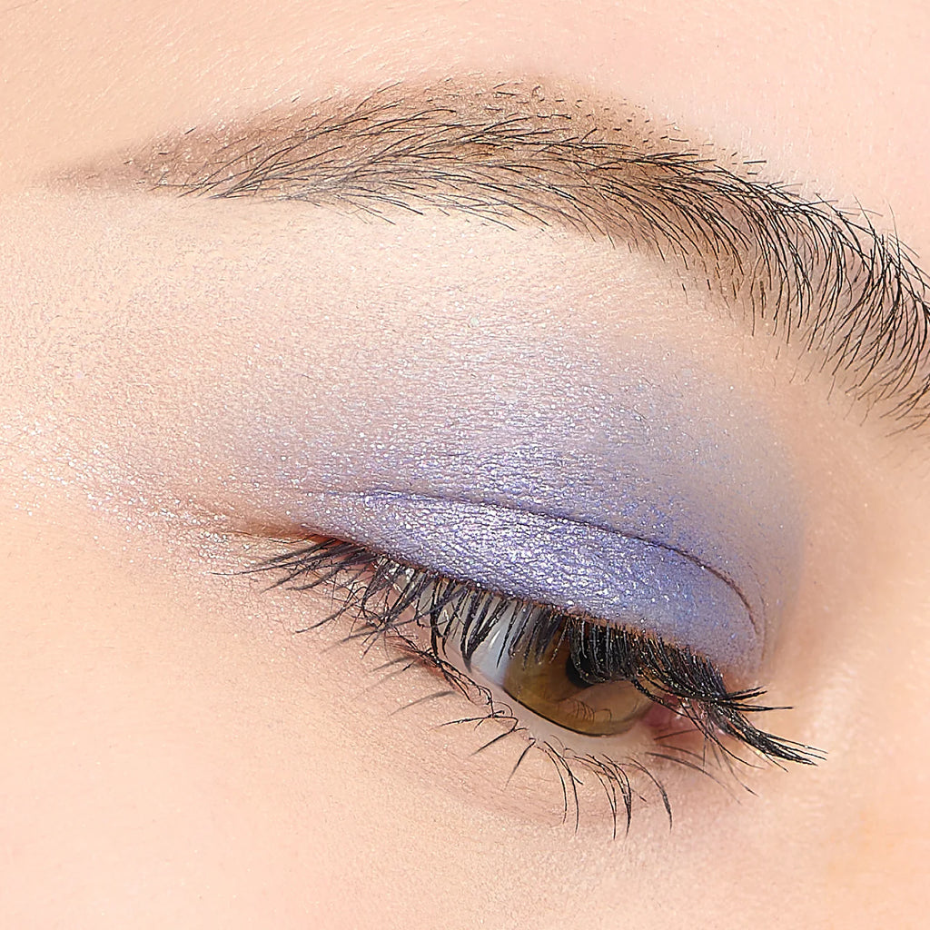 Close-up of an eyelid featuring Elégance Razzle Eye Color in lavender, showcasing a delicate and ethereal eye makeup look.