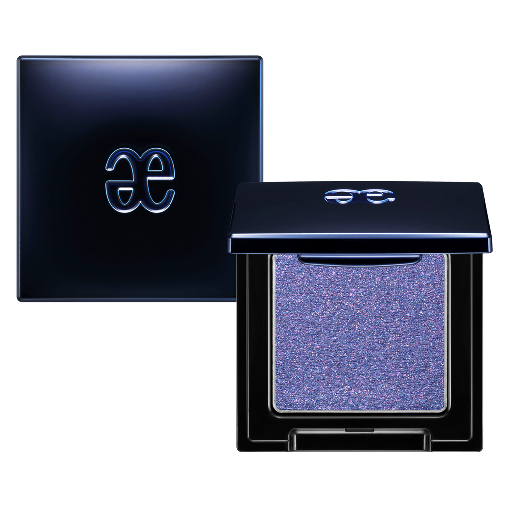 Elégance Razzle Eye Color in shimmering lavender shade, encased in a stylish black compact. Ideal for soft and dreamy eye makeup.