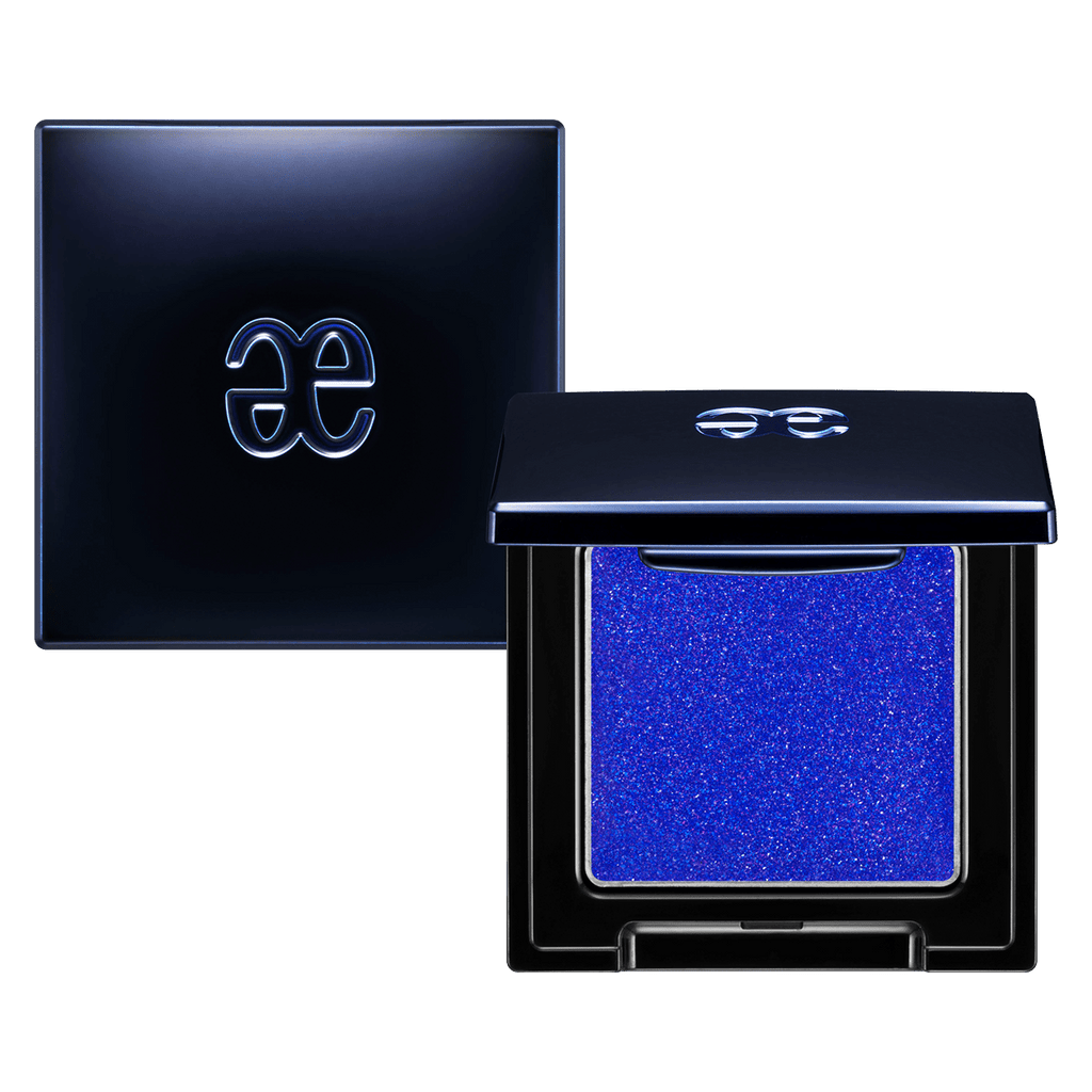 Elégance Razzle Eye Color in electric blue shade, encased in a stylish black compact. Ideal for bold and dramatic eye makeup.