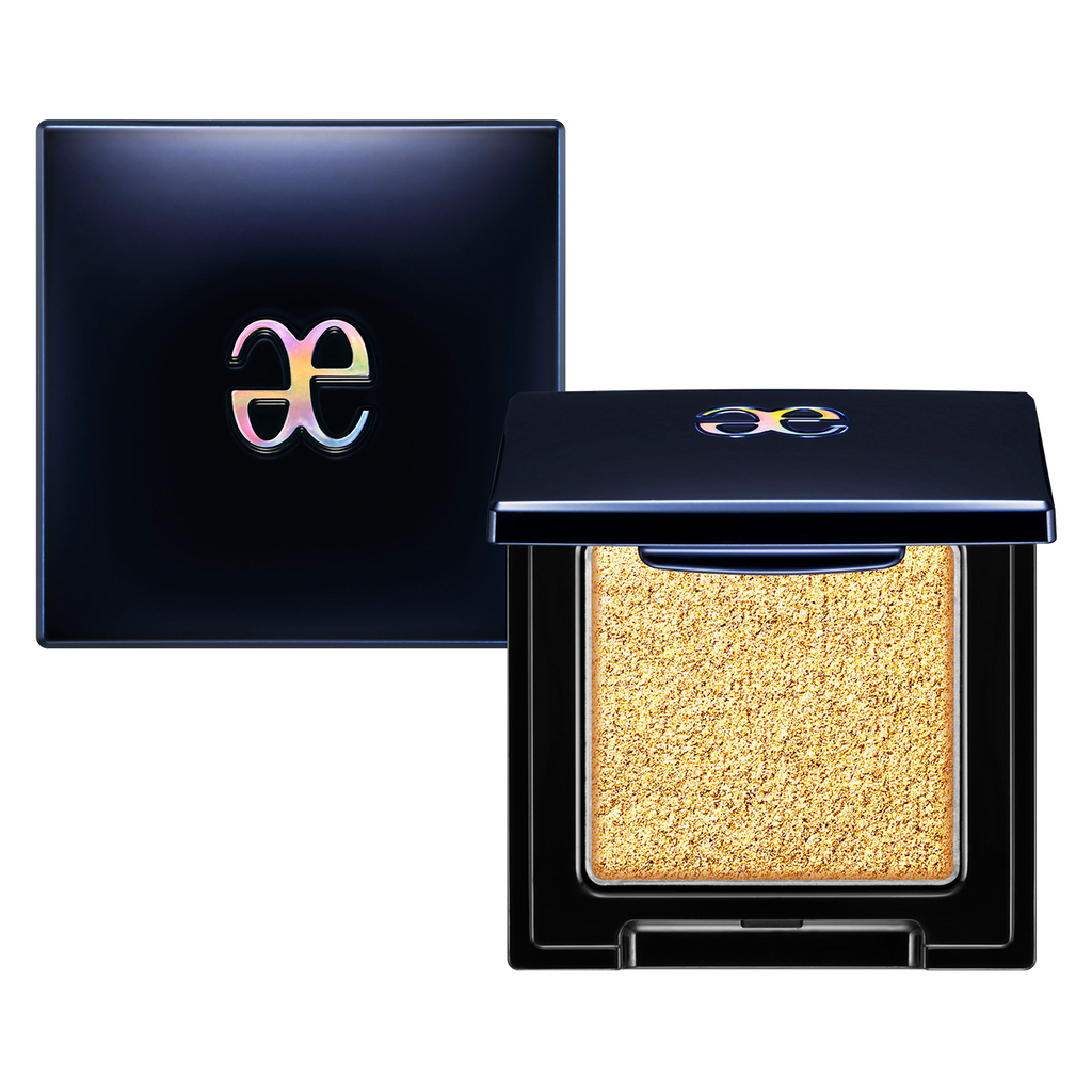 Elégance Razzle Star Eye Color in a shimmering gold shade with a glittery finish, presented in a stylish black compact with a glossy logo.