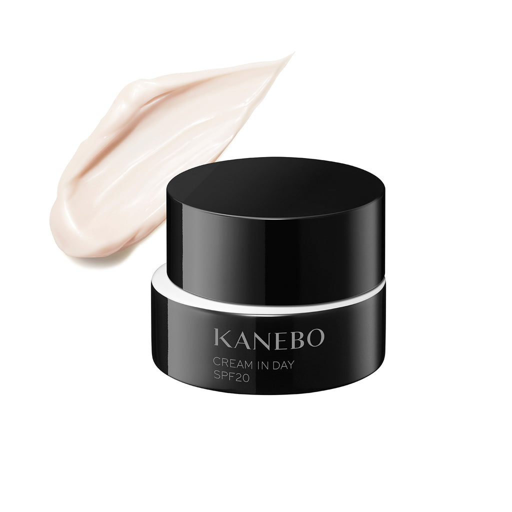 Kanebo Cream in Day 40g with SPF20 in a sleek black jar, displayed alongside a creamy texture swatch. Ideal for daily skincare.