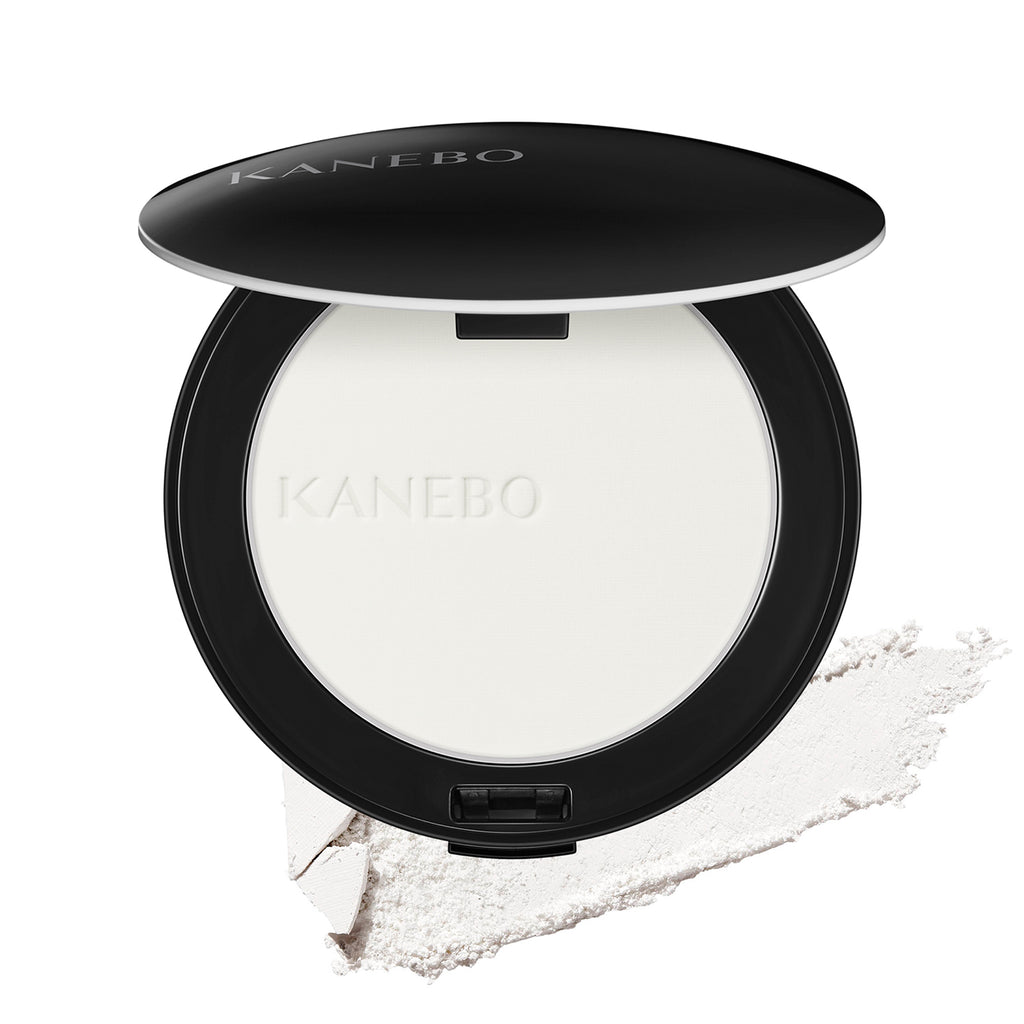 Kanebo Crystallized Fix Powder in sleek black compact with finely milled white powder and smooth texture for flawless finish.