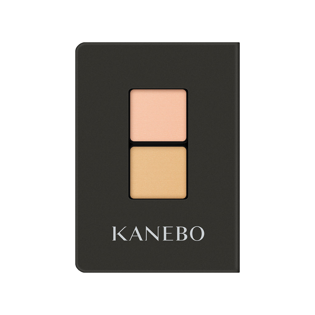 Kanebo Eye Color Duo with peach and beige matte shades in a sleek black compact, ideal for subtle and natural eye makeup.