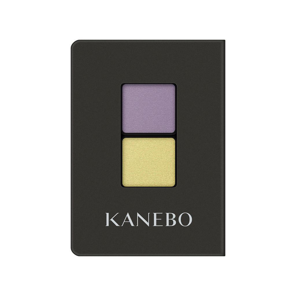 Kanebo Eye Color Duo with lavender and yellow shades in a sleek black compact, ideal for vibrant and contrasting eye makeup.