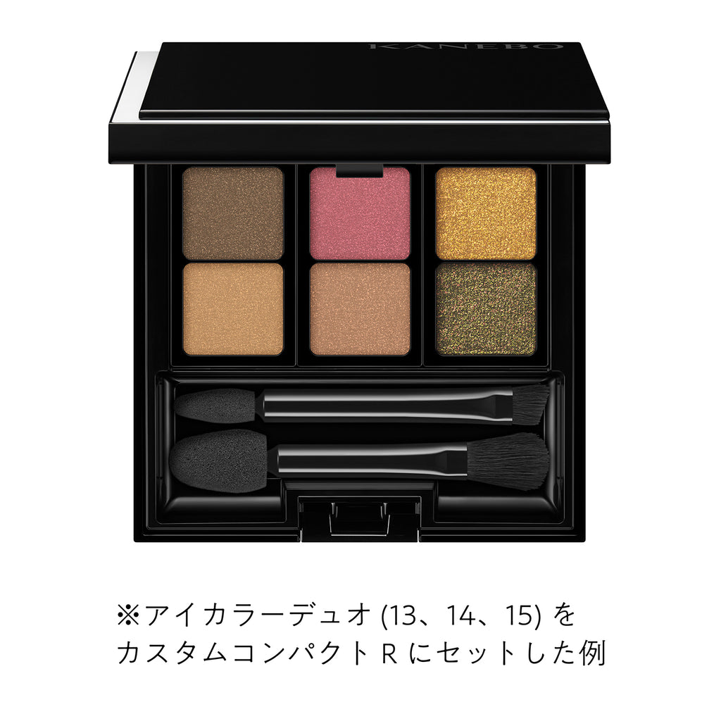 Kanebo Custom Compact R showcasing a set of refillable eye shadow pans in vibrant shades with included applicators for versatile makeup.