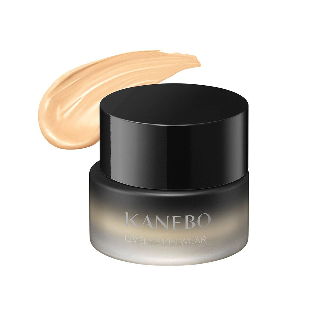 Kanebo Lively Skin Wear 30g foundation in a black jar with a swatch of light neutral shade, designed for a smooth and radiant complexion.