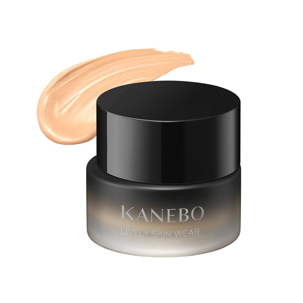 Kanebo Lively Skin Wear 30g foundation in a black jar with a swatch of warm beige shade, providing smooth and radiant skin coverage.