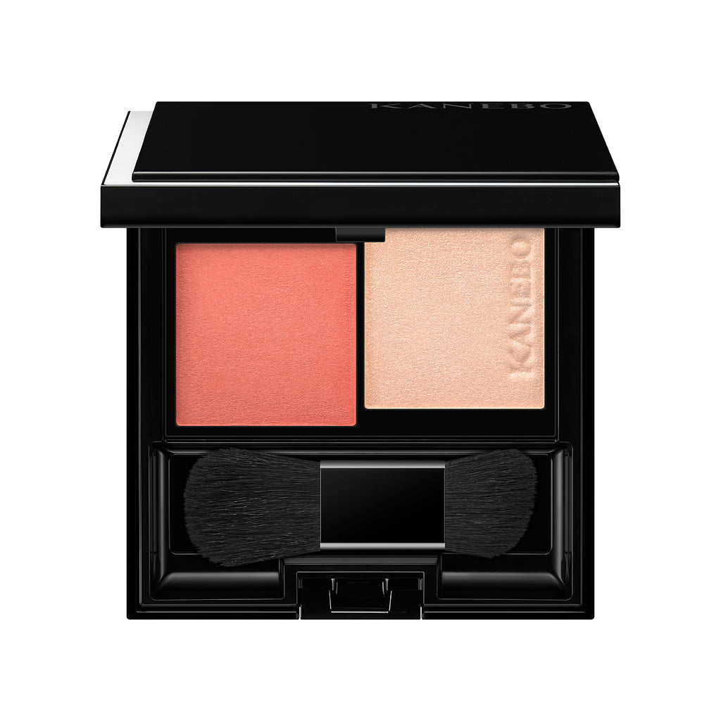 Kanebo Mood Boosting Blush in coral and beige shades with a compact design, dual brush, and sleek black case.