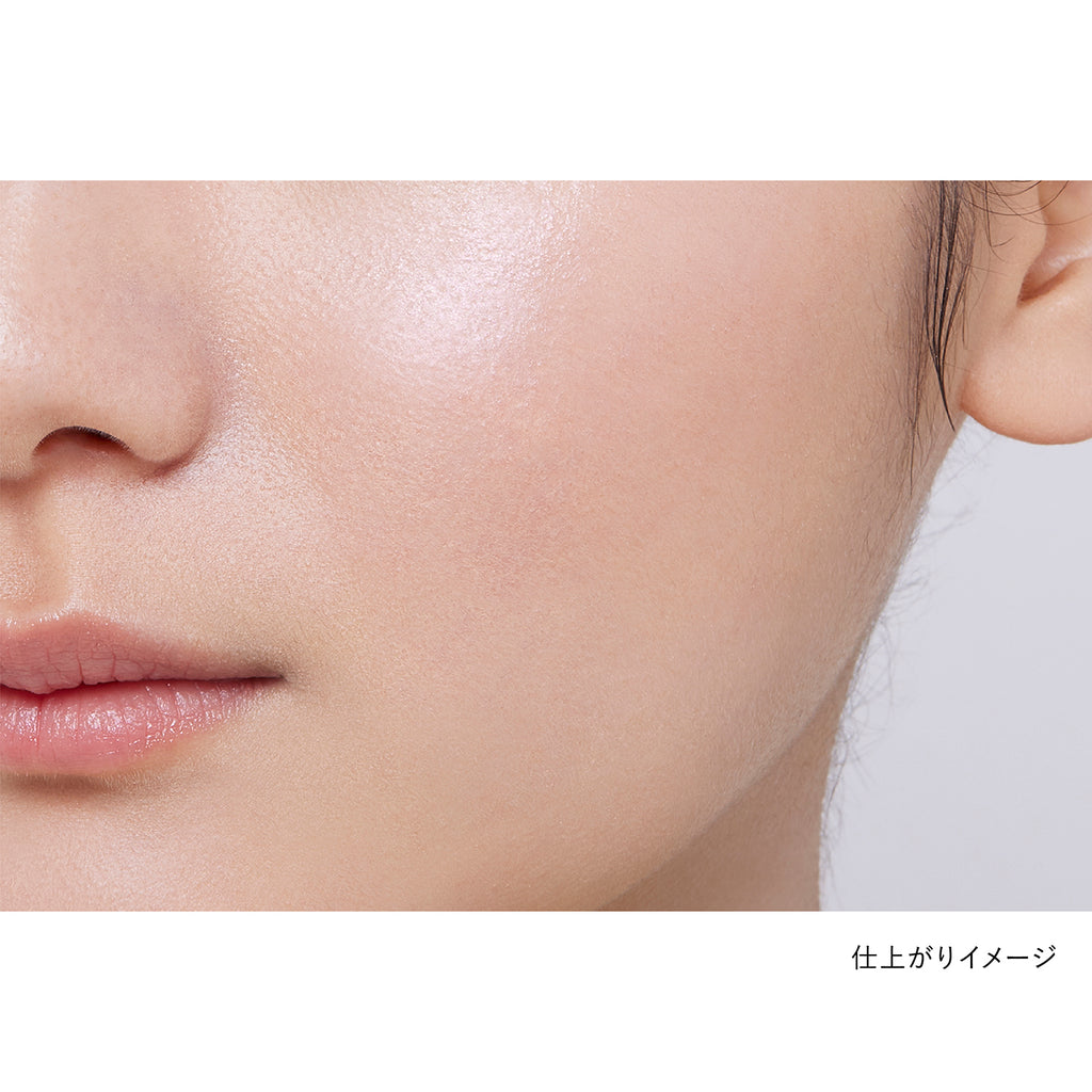 Close-up of a model's cheek showcasing the natural finish of Kanebo Mood Boosting Blush in brown and lavender tones.