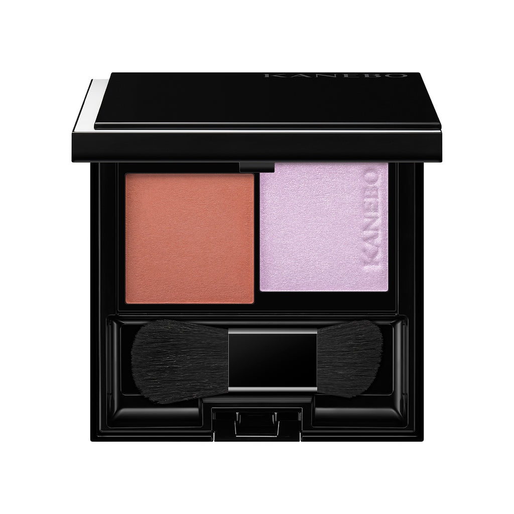 Kanebo Mood Boosting Blush in brown and lavender shades with a compact design, dual brush, and sleek black case.